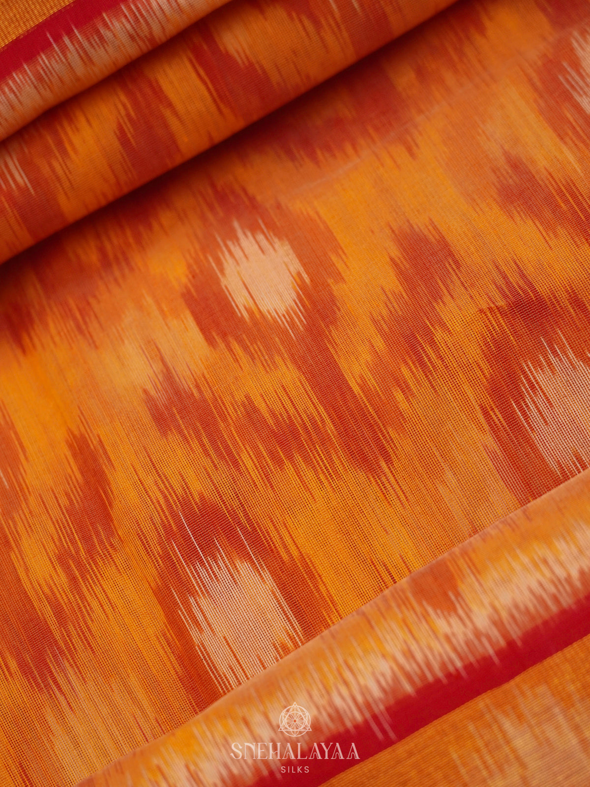 Orange Ikat Silk Cotton Saree with Traditional Woven Border