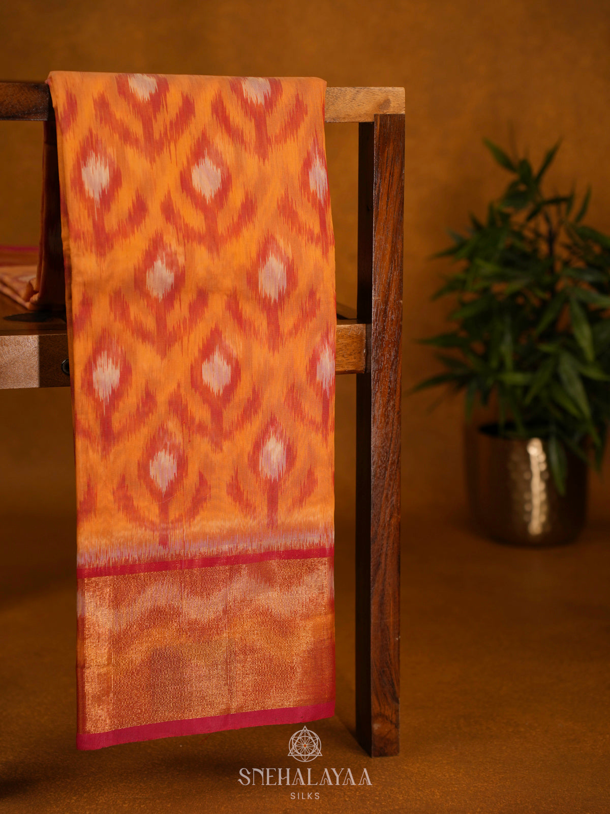 Orange Ikat Silk Cotton Saree with Traditional Woven Border