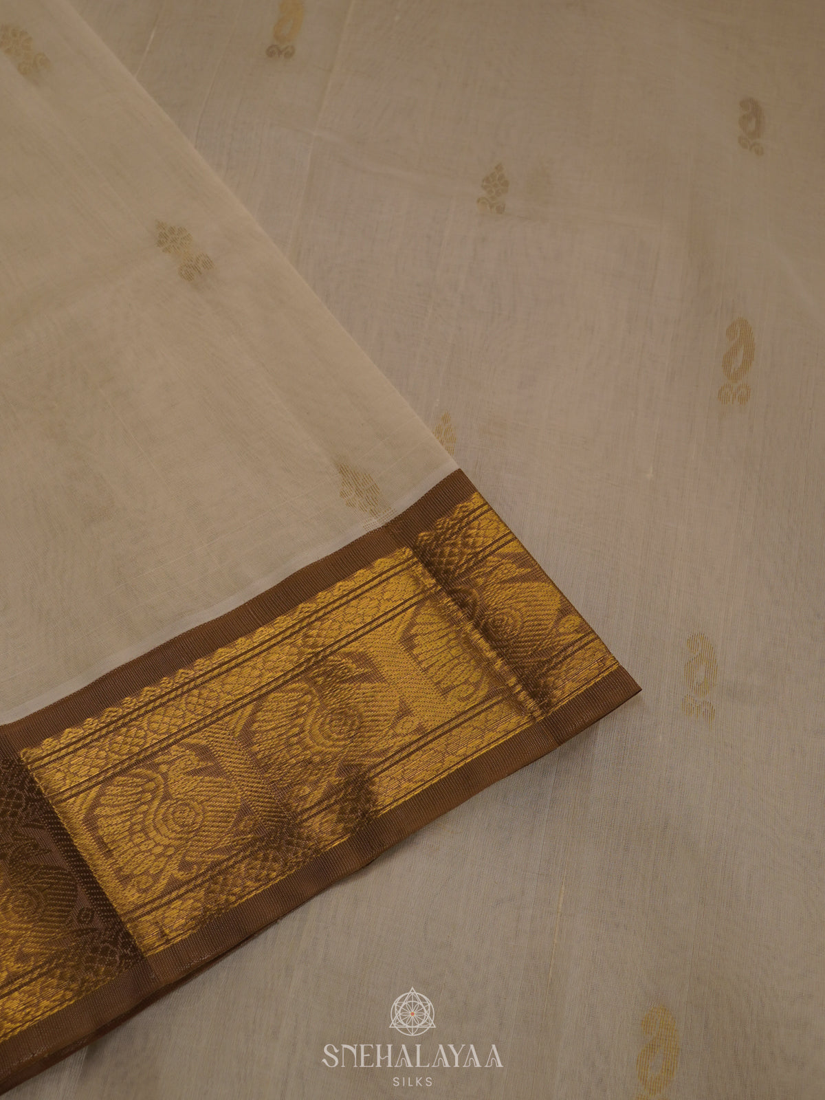 Off White Silk Cotton Saree with Zari Woven Buttas and Rich Golden Zari Border