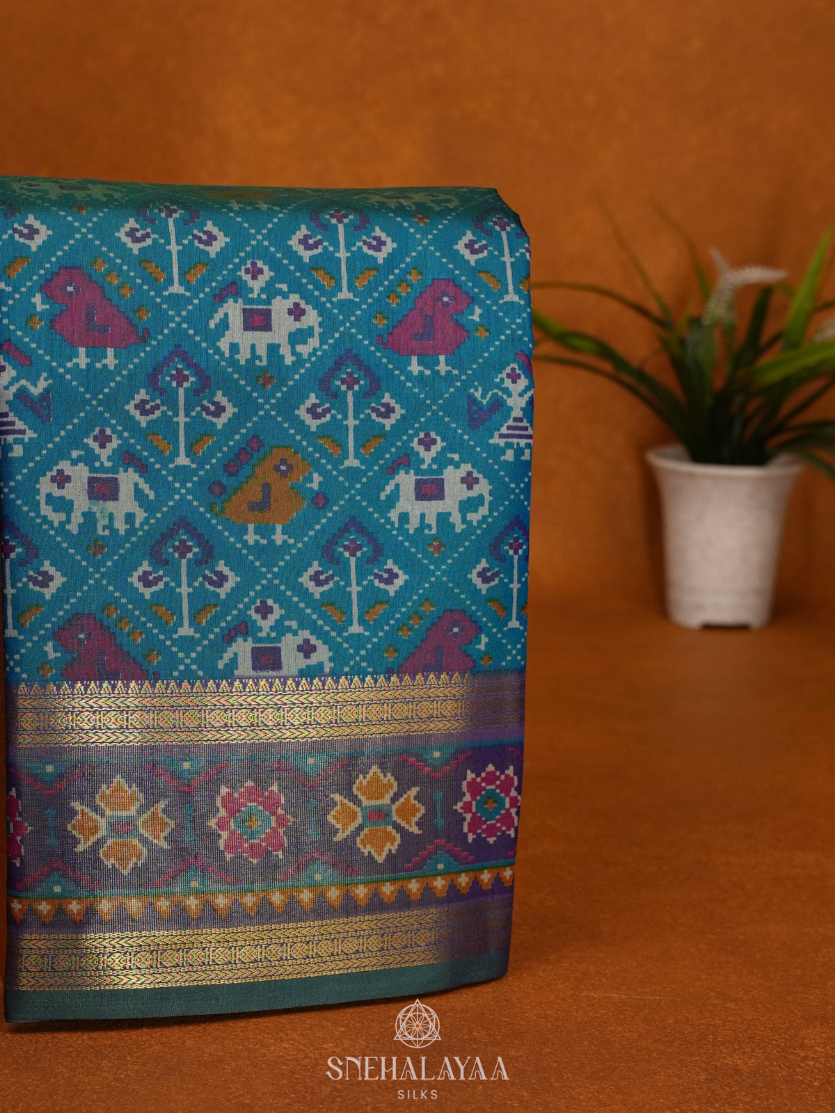 Teal Green Ikat Saree