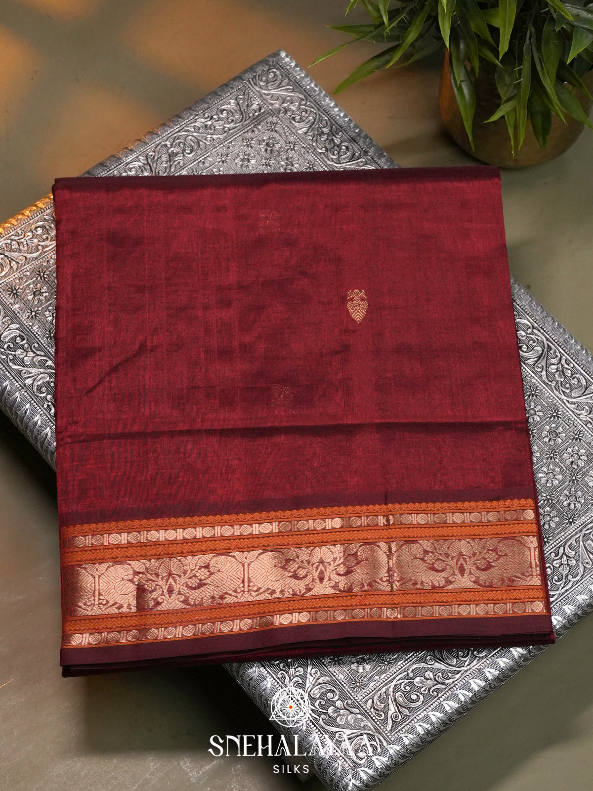 Maroon Kanchi Silk Cotton Saree with Burnt Orange and Antique Gold Peacock Border