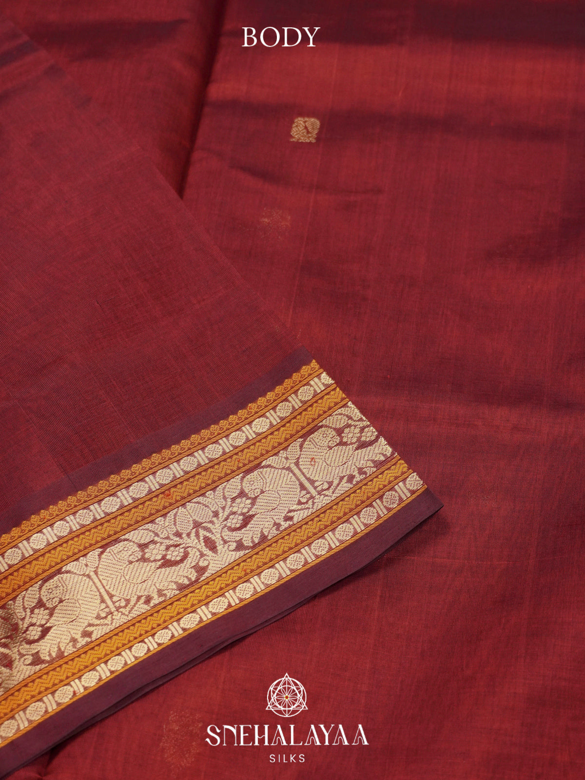 Maroon Kanchi Silk Cotton Saree with Burnt Orange and Antique Gold Peacock Border