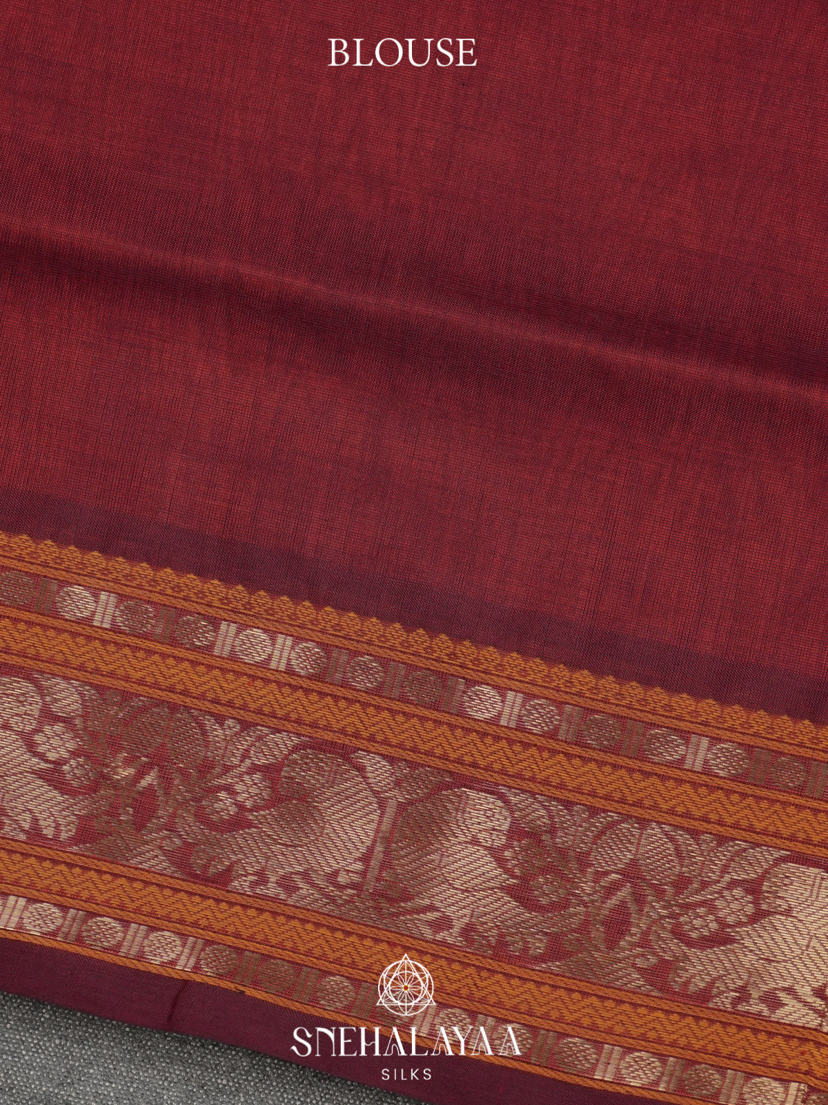 Maroon Kanchi Silk Cotton Saree with Burnt Orange and Antique Gold Peacock Border