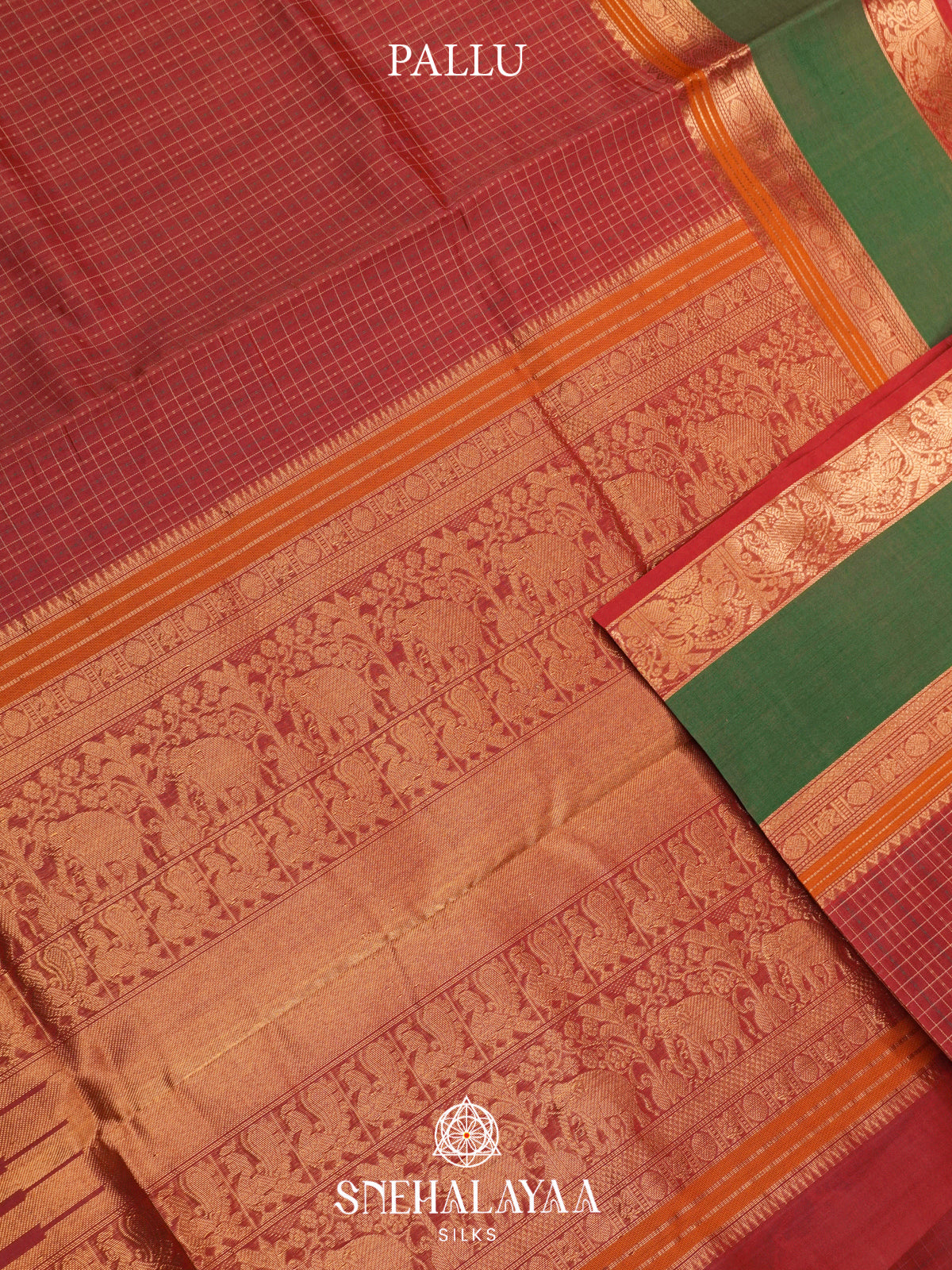 Maroon Silk Cotton Saree with Green Elephant Zari Border
