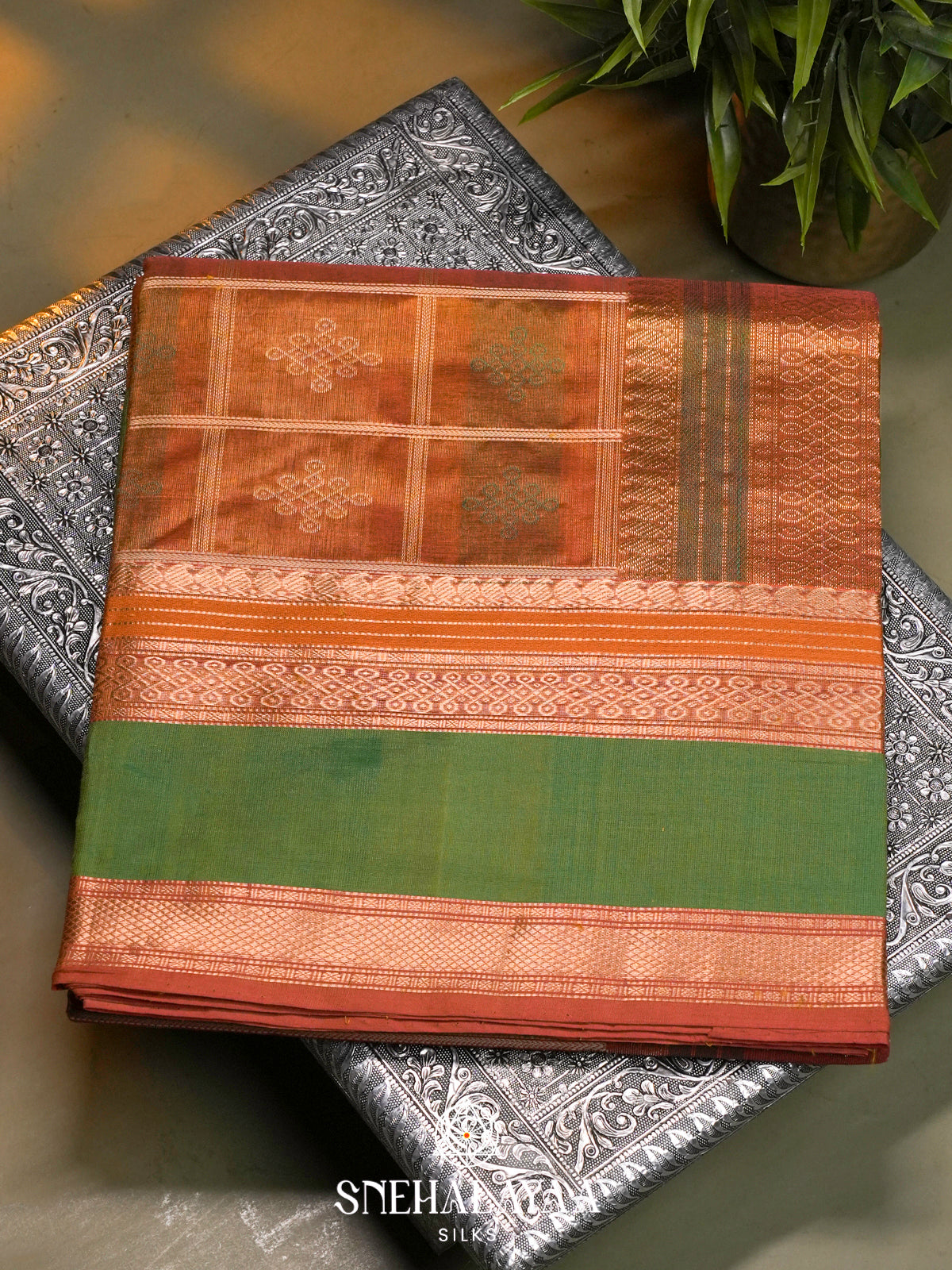 Rust Orange Kanchi Silk Cotton Saree with Traditional Kolam Buttas & Contrast Green Borde