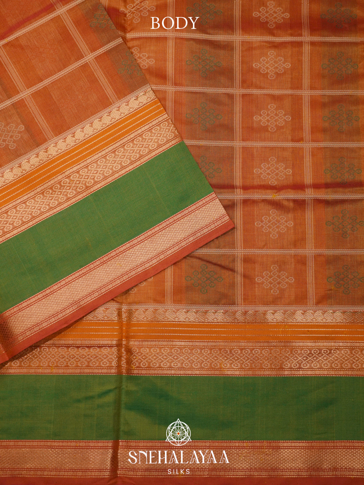 Rust Orange Kanchi Silk Cotton Saree with Traditional Kolam Buttas & Contrast Green Borde