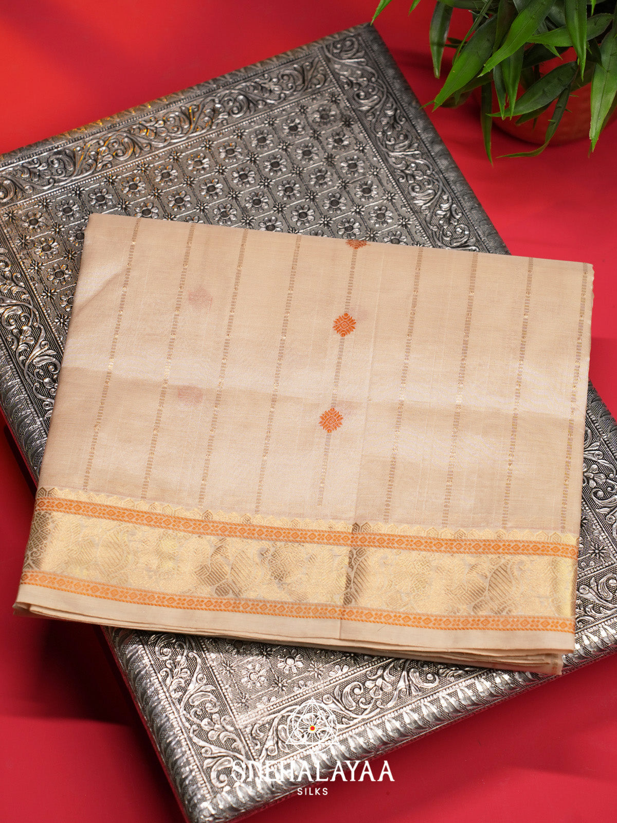 Cream Striped Silk Cotton Saree with Orange Buttas and Gold Zari Border