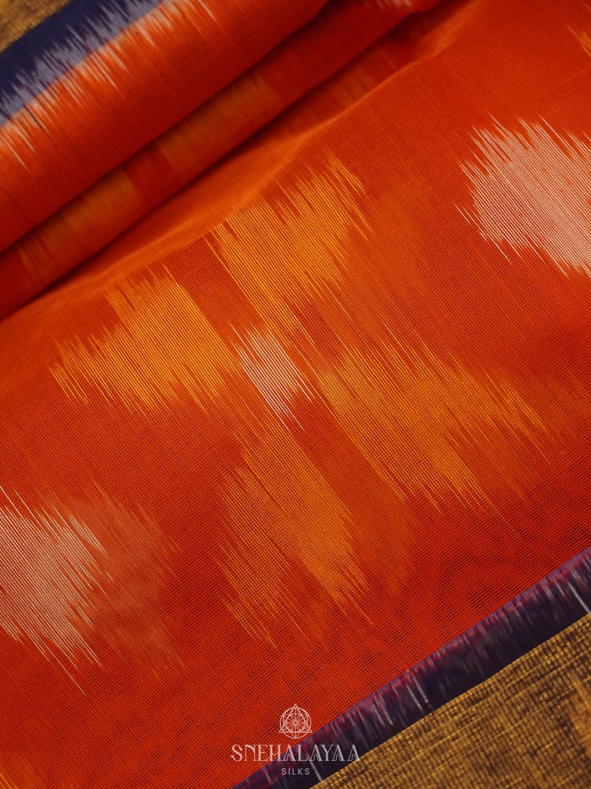 Orange Ikat Silk Cotton Saree with Traditional Woven Border