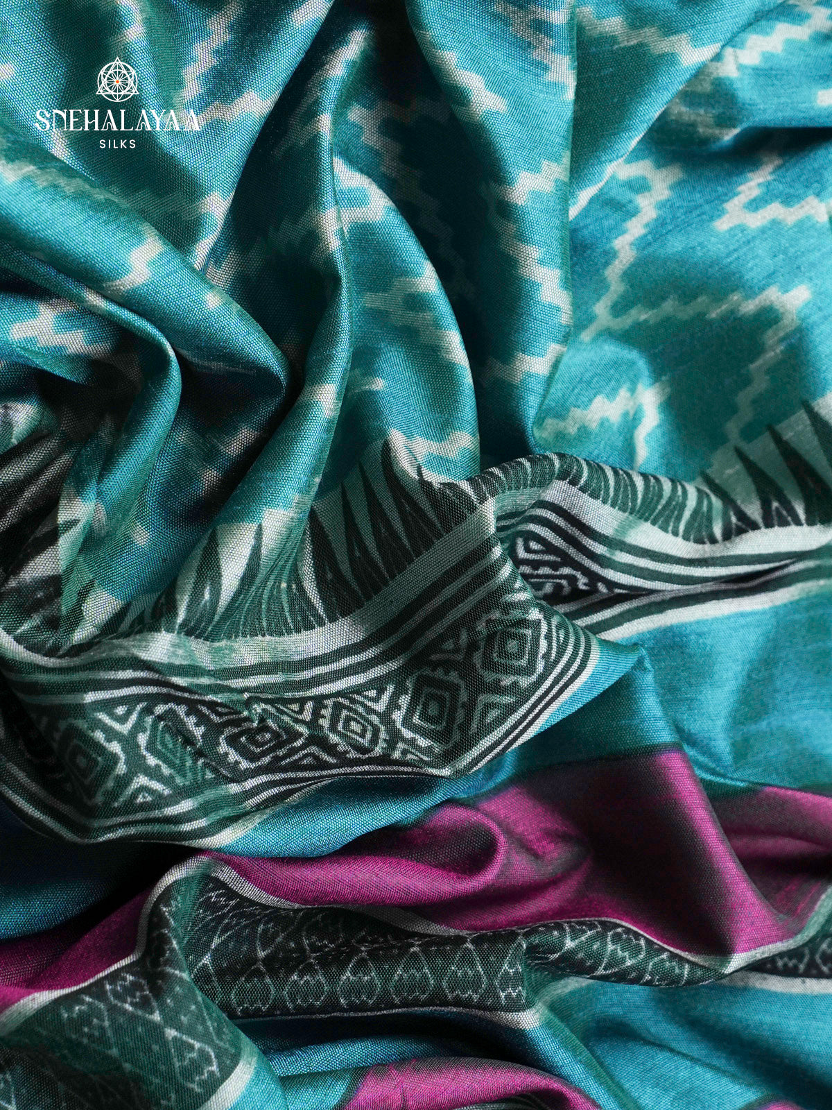 Teal Green Ikat Silk Saree