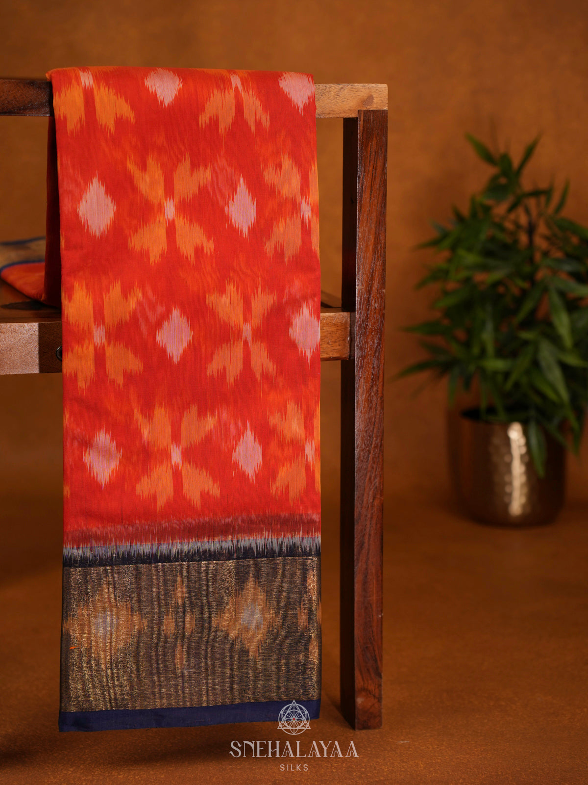 Orange Ikat Silk Cotton Saree with Traditional Woven Border