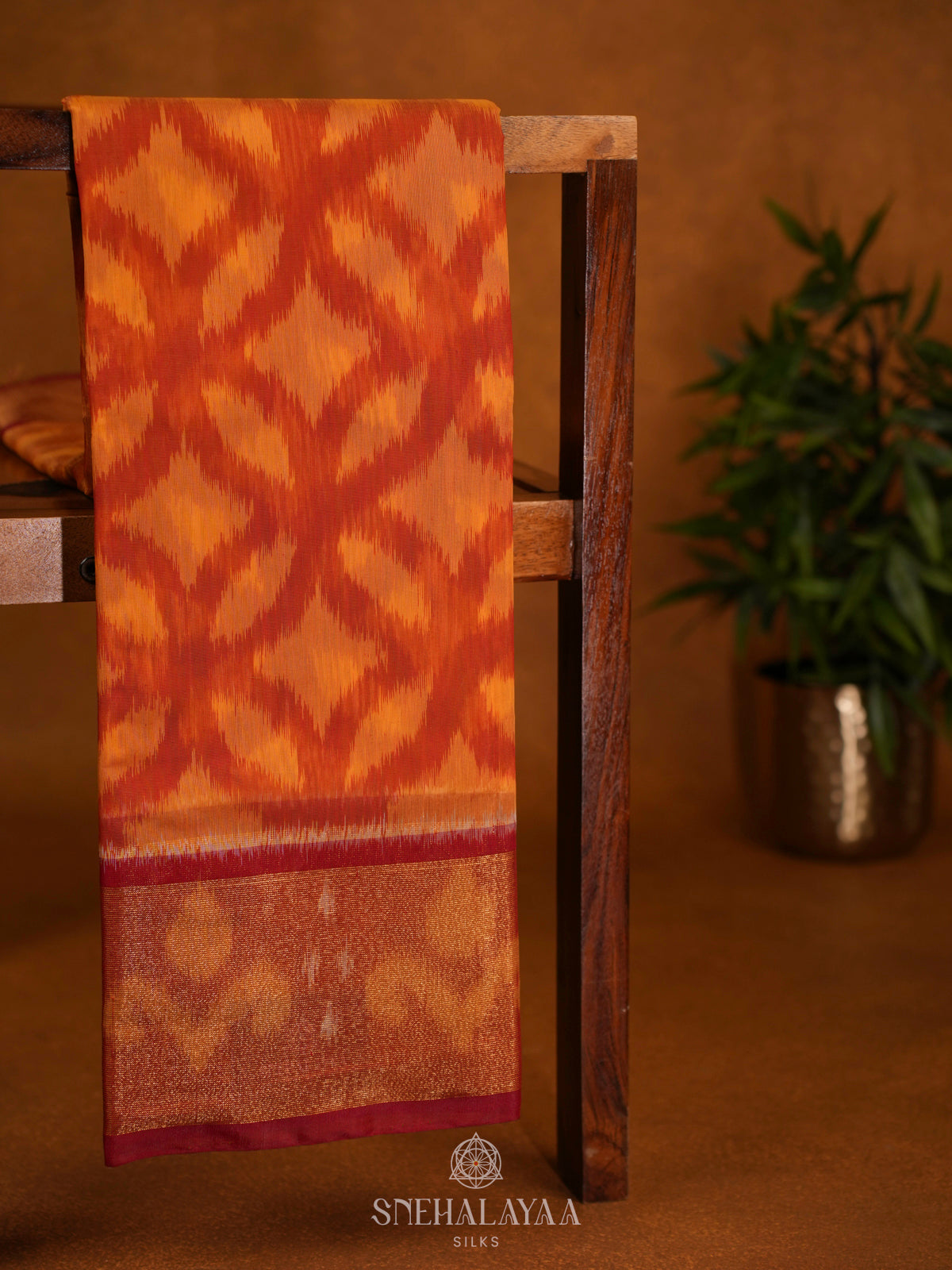 Sunset Orange Ikat Silk Cotton Saree with Traditional Woven Border