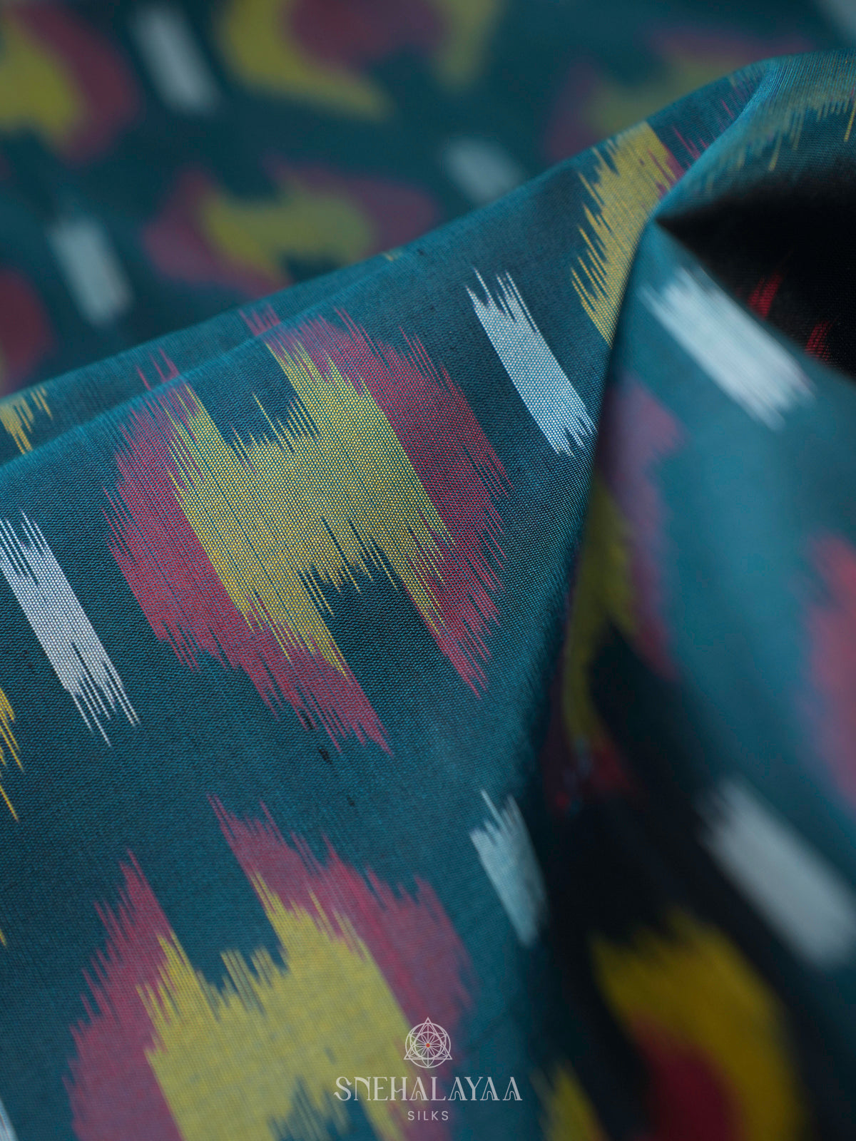 Peacock Blue Ikat Soft Silk Saree